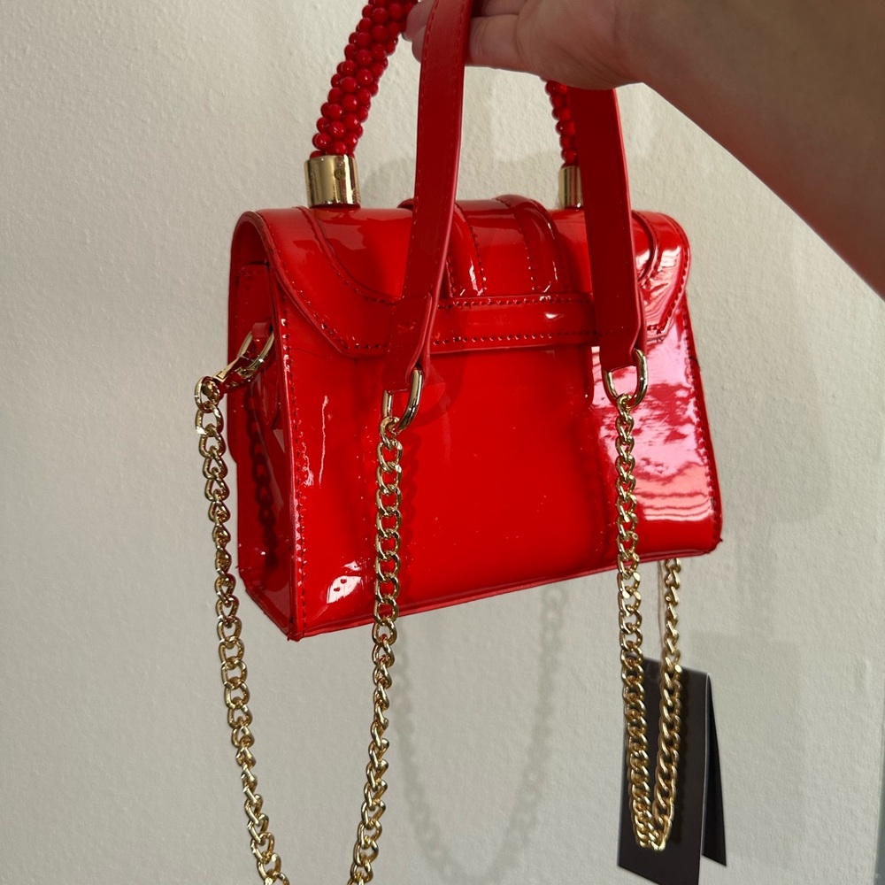 Vibrant Red Mini Bag with Gold Chain and Structured Shape